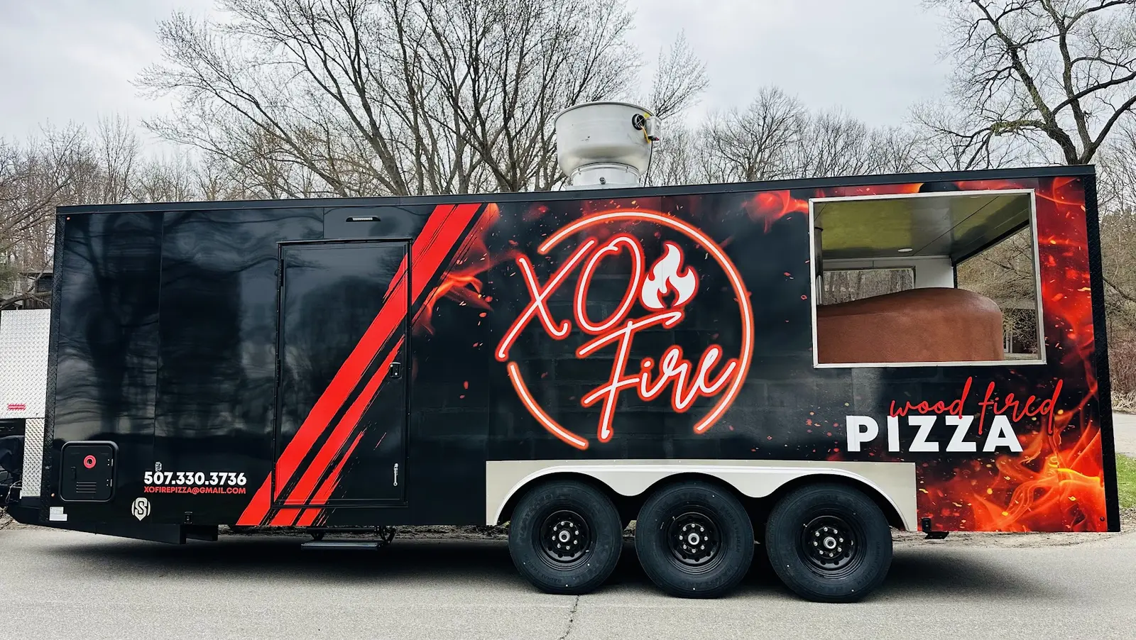 Custom black and red food trailer wrap completed by St. Croix Wraps & Graphics