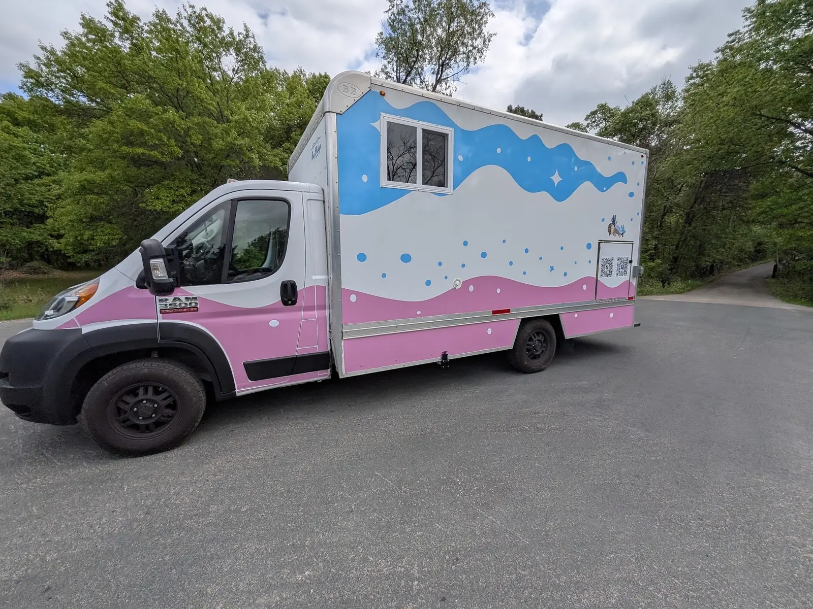 Pink and blue mobile ice cream truck wrap viewed from the front side