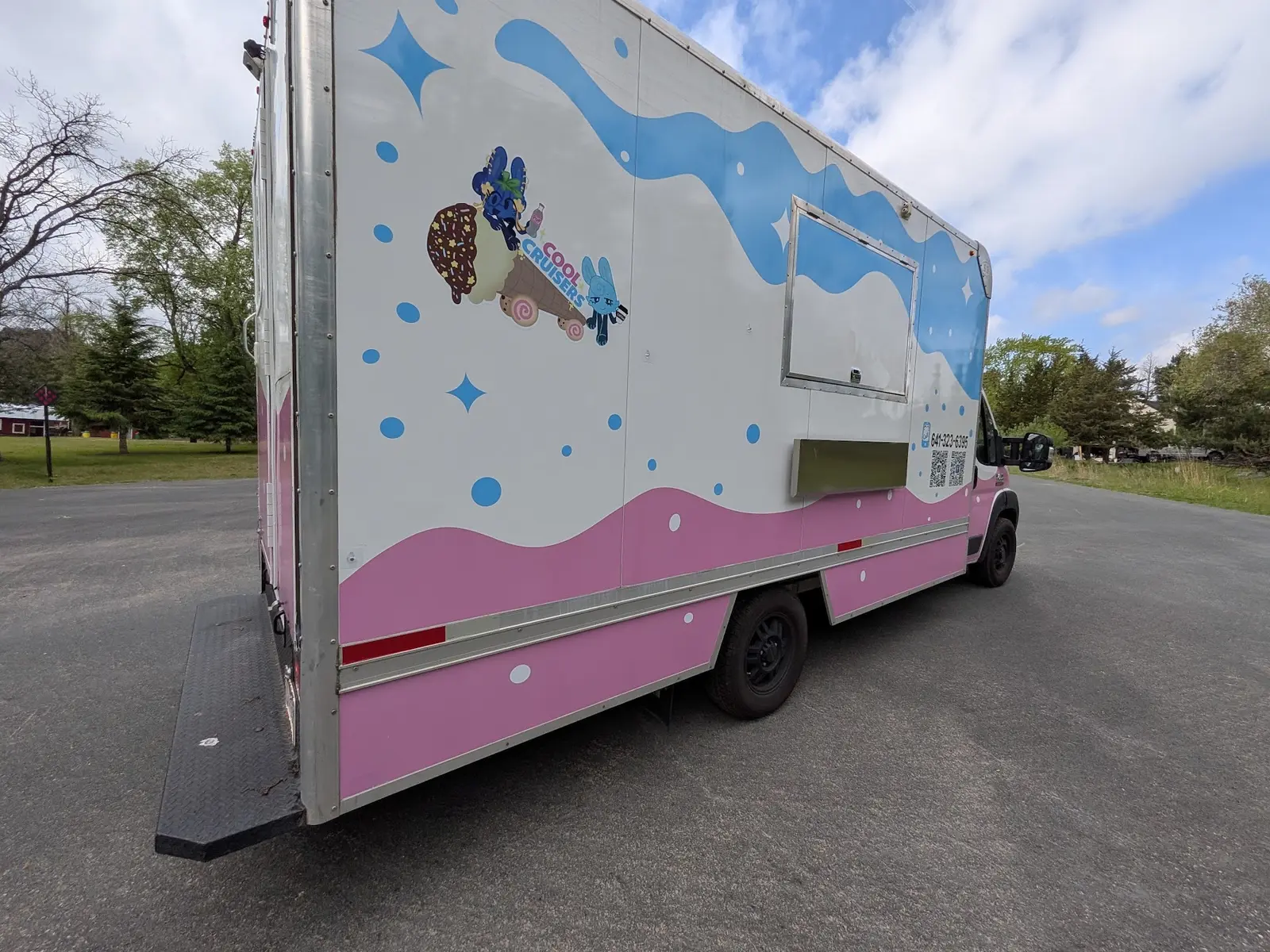 Pink and blue mobile ice cream truck wrap viewed from the rear side