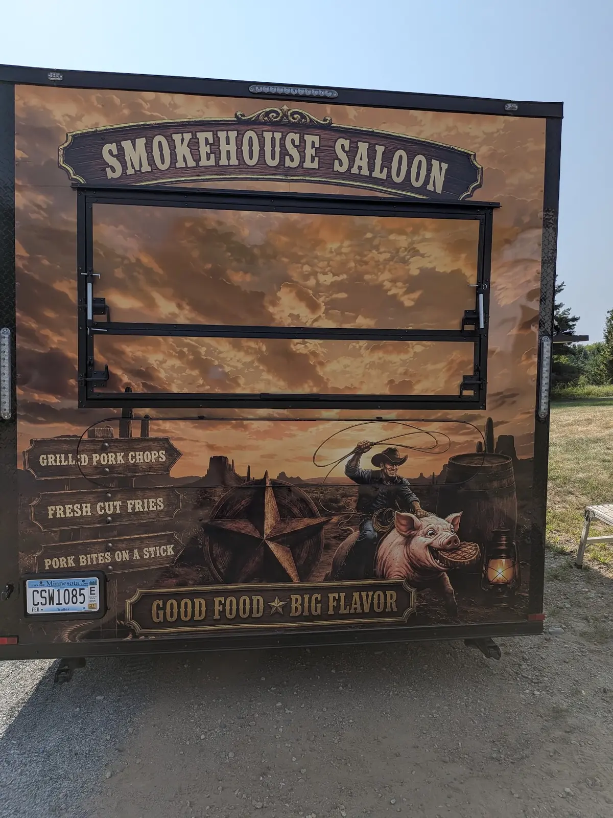 Close-up detail of a finished western-themed concession trailer wrap